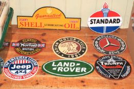 Eight cast iron motoring signs including Land Rover, Mercedes Benz, Shell Oil, Indian,