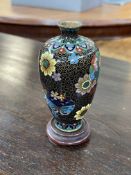 Small floral decorated cloisonné vase on stand, 12cm high.