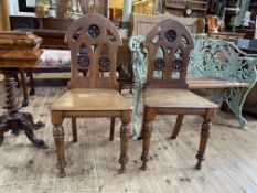 Pair Victorian oak arched back hall chairs.