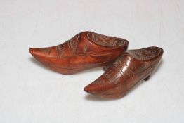 Two HOLLAND carved wood shoe snuff boxes.