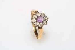 Amethyst and diamond cluster 18 carat white gold ring, size O.