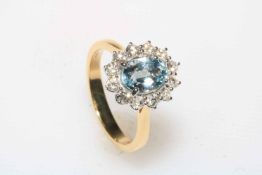 Aquamarine and diamond cluster ring set in 18 carat yellow gold, aquamarine 1.25 carats, diamond 0.
