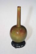 Chinese slender neck green/brown glazed vase, 21.5cm, with stand.