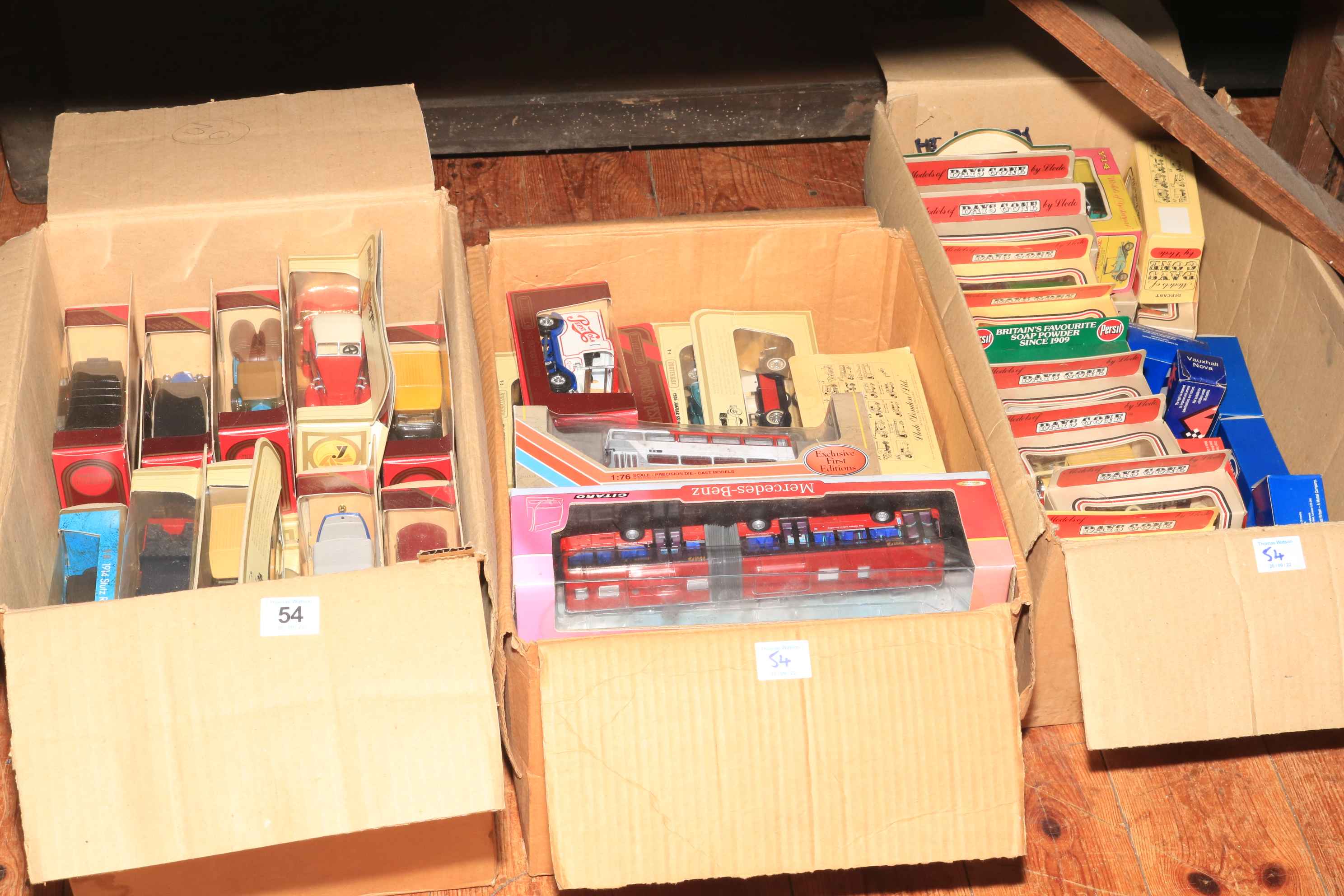 Three boxes of Yesteryear and Days Gone By model vehicles.
