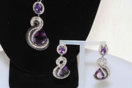 Impressive amethyst jewellery pendant and earrings in 18 carat white gold.