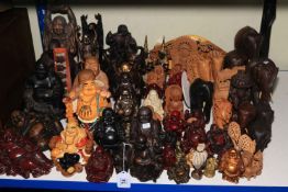 Collection of ornamental Buddha's, carved wood elephants, etc.