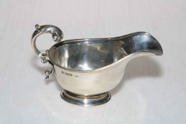 Silver sauce boat with scroll handle, Birmingham 1947.