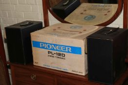 Pioneer PL-12D turntable and two Kodak carousel projectors.