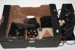 Coronet 9-5mm camera and projector with Walt Disney film reels.