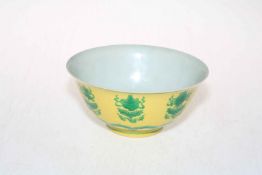 Chinese yellow and green glazed patterned bowl, blue mark to base, 17.5cm diameter.