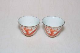 Pair Chinese iron red dragon tea bowls.