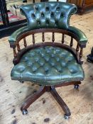 Green deep buttoned leather Captains style swivel desk chair.