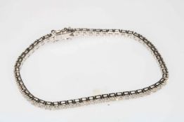 Diamond and 18 carat white gold tennis bracelet, diamonds total 5.35 carat, 18cm length.