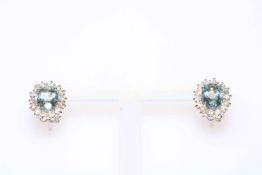 Pair of aquamarine and diamond cluster earrings, having oval aquamarine total 1.