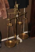 Large brass set of twin balance scales with a set of integrated weights.