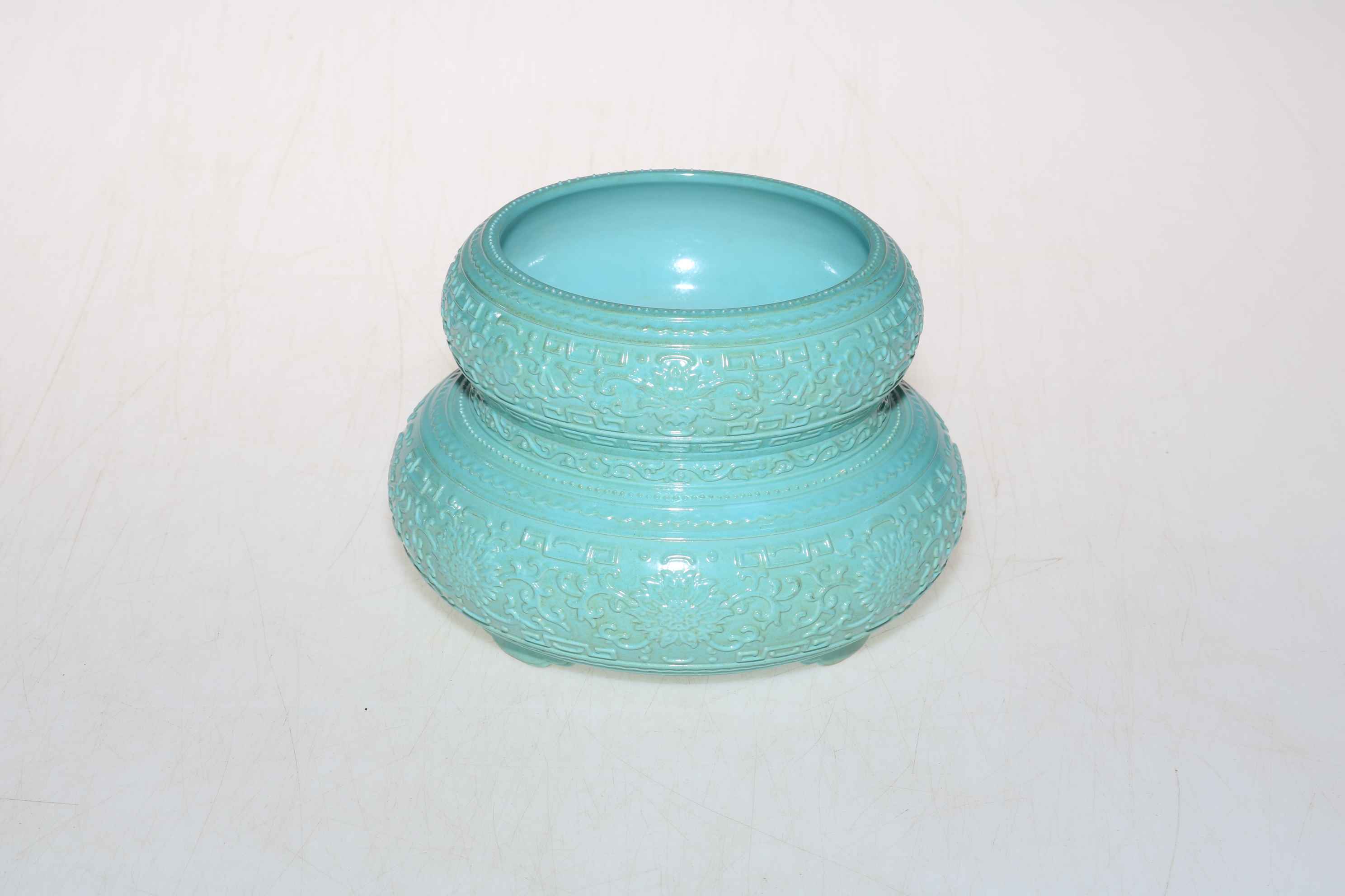 Chinese blue glazed censor with intricate relief decoration, 15cm diameter.