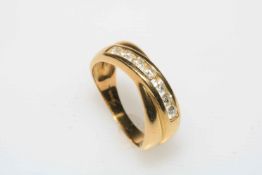 Diamond seven stone 18k gold ring, size O.