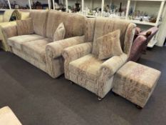 Paisley patterned two seater settee, wing back chair and footstool.