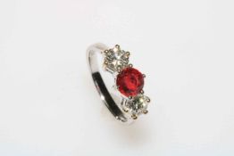 Good ruby and diamond three stone 18 carat white gold ring, the over 1 carat ruby flanked by 0.