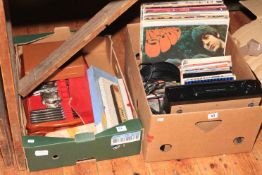 Box with LP records, 45rpm, CD's and turntable.