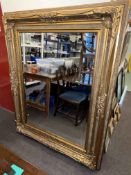 Large gilt framed rectangular bevelled wall mirror, 157cm by 127cm overall.