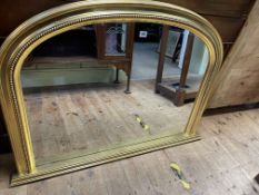Arched top gilt framed overmantel mirror, 78cm by 112cm.