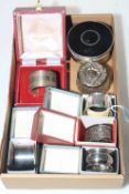 Five silver napkin rings, silver and tortoiseshell ring box and silver topped jar (7).