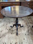 Georgian circular oak snap top supper table on turned pedestal tripod base, 71.5cm by 87cm diameter.