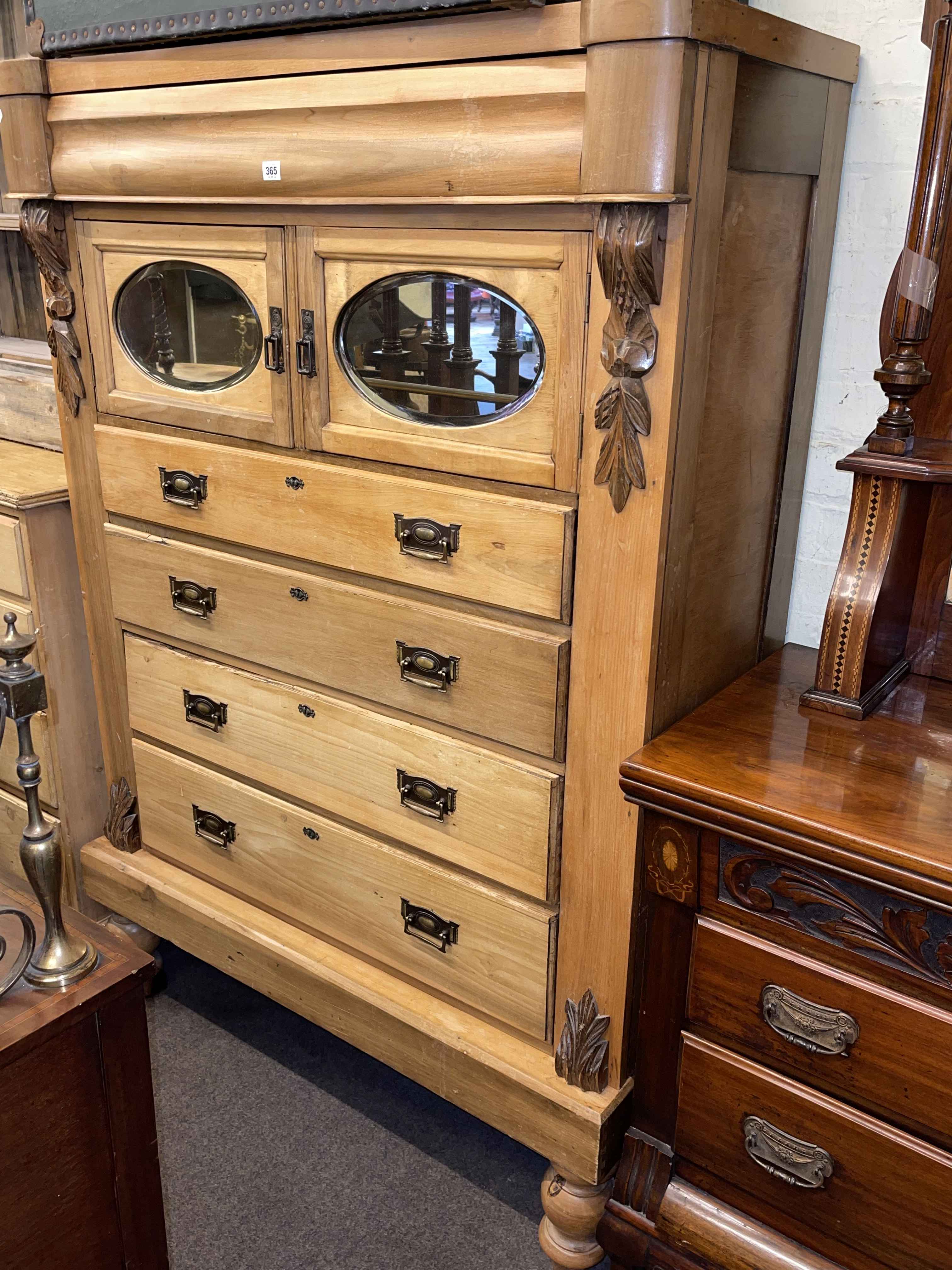 Late Victorian stripped scotch chest having five drawers and two mirror panelled cupboard doors,