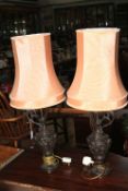Pair of metal ewer table lamps with silk shades.