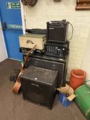 Large speaker, amplifiers, vintage turntable, guitar and music stand.