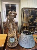 Composite fisherman figure clock table lamp, 76cm high.