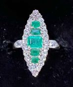 Emerald and diamond marquise set yellow gold ring,