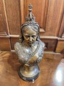 Bronzed effect bust of Queen Victoria on a marble base, 43cm high.