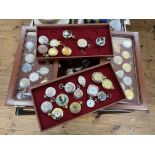 Collection of pocket watches with two three drawer cabinets.