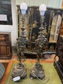 Pair of ornate gilt cherub table lamps, 74cm high.