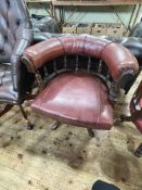 Late Victorian Captains style swivel desk chair in red studded hide.