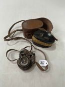 WWII compass with WWI case, and pair of hair brushes.