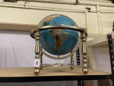 Terrestrial globe on brass stand, approximately 55cm high.
