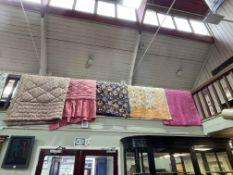 Collection of five various quilts/eiderdowns including Paisley, floral, etc.