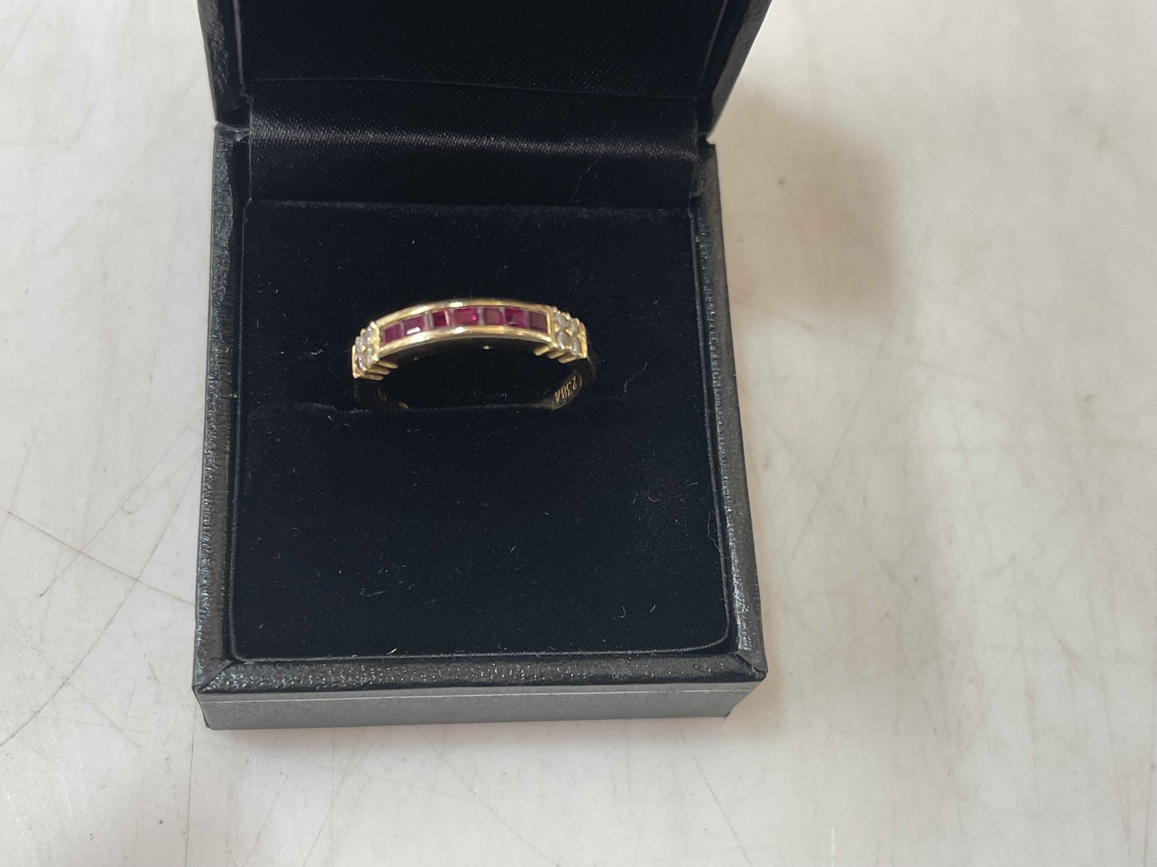 Ruby and diamond 18 carat gold ring, size M.