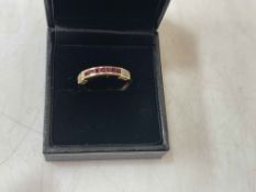 Ruby and diamond 18 carat gold ring, size M.