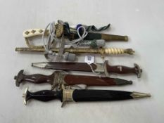 Collection of mostly replica German daggers (5), and portepee's.