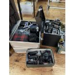 Collection of cameras and binoculars.