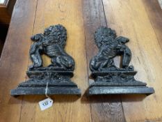 Pair of cast iron lion doorstops, 36cm high.