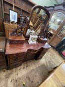 Victorian mahogany shaped serpentine centre dressing table, 159cm by 138cm by 54cm.