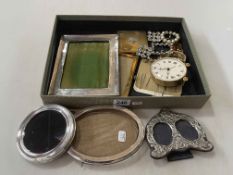 Four silver mounted photograph frames, hat pins, buckles, compact, Swiza clock.