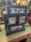 Chinese black lacquered table cabinet having two drawers and two cupboard doors with figure