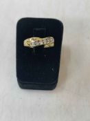 18 carat gold seven stone diamond ring, size T.