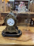 French boule clock, 43cm high, under glass dome with plinth.